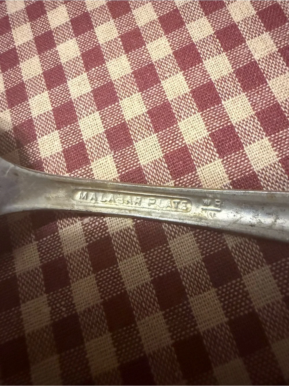 Decorative Silver-Tone Serving Spoon with Ornate Handle